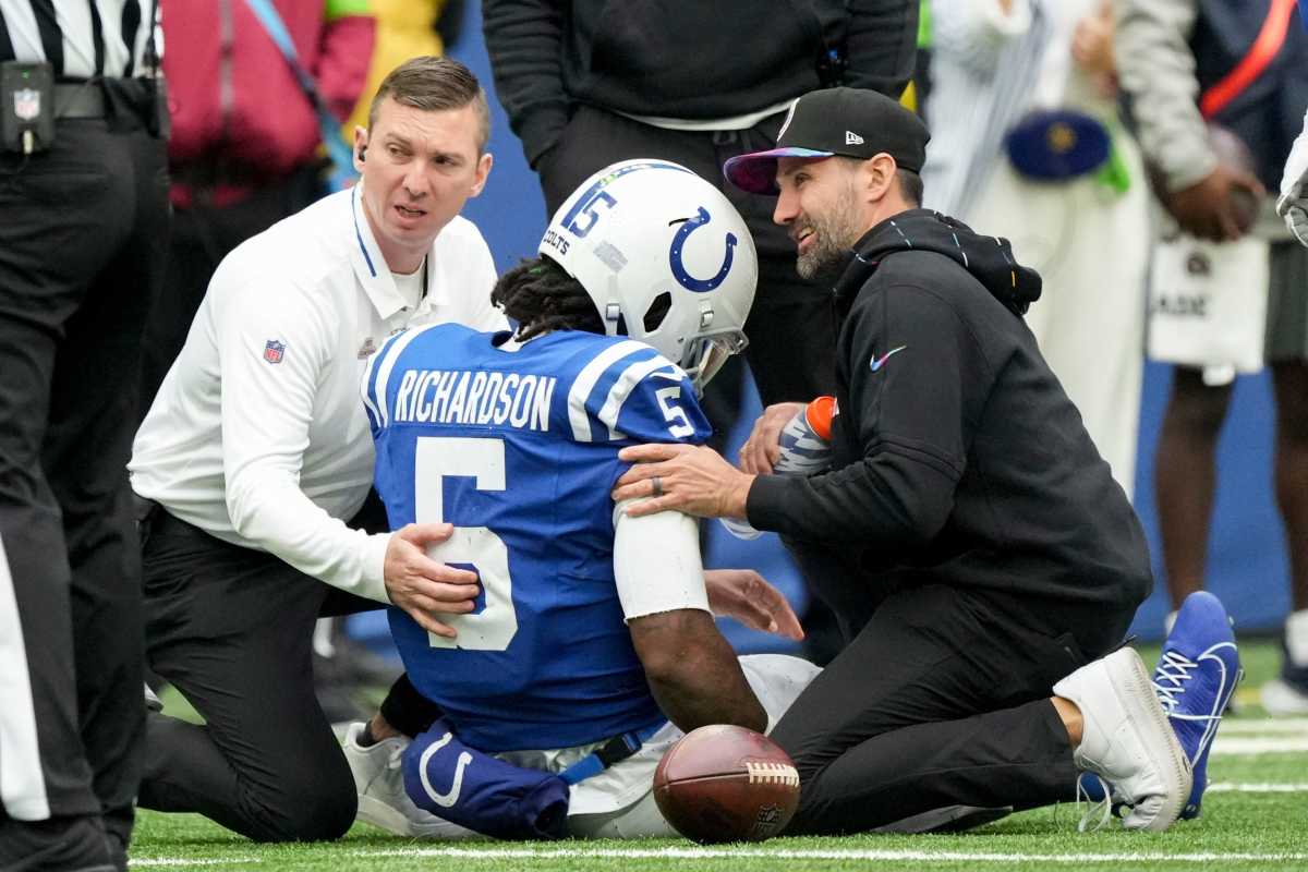 Team personnel tend to Indianapolis Colts quarterback Anthony Richardson (5) after hurting his shoulder Sunday, Oct. 8, 2023, during a game against the Tennessee Titans at Lucas Oil Stadium in Indianapolis.  